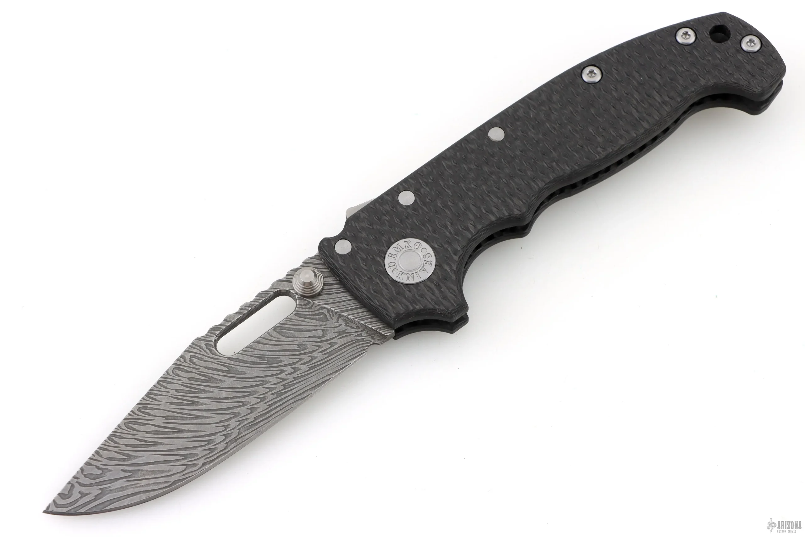 MG AD20I-Fafnir Damasteel Italian Machine Ground Clip Point Blade with Thumb Slot, Textured Carbon Fiber Handles